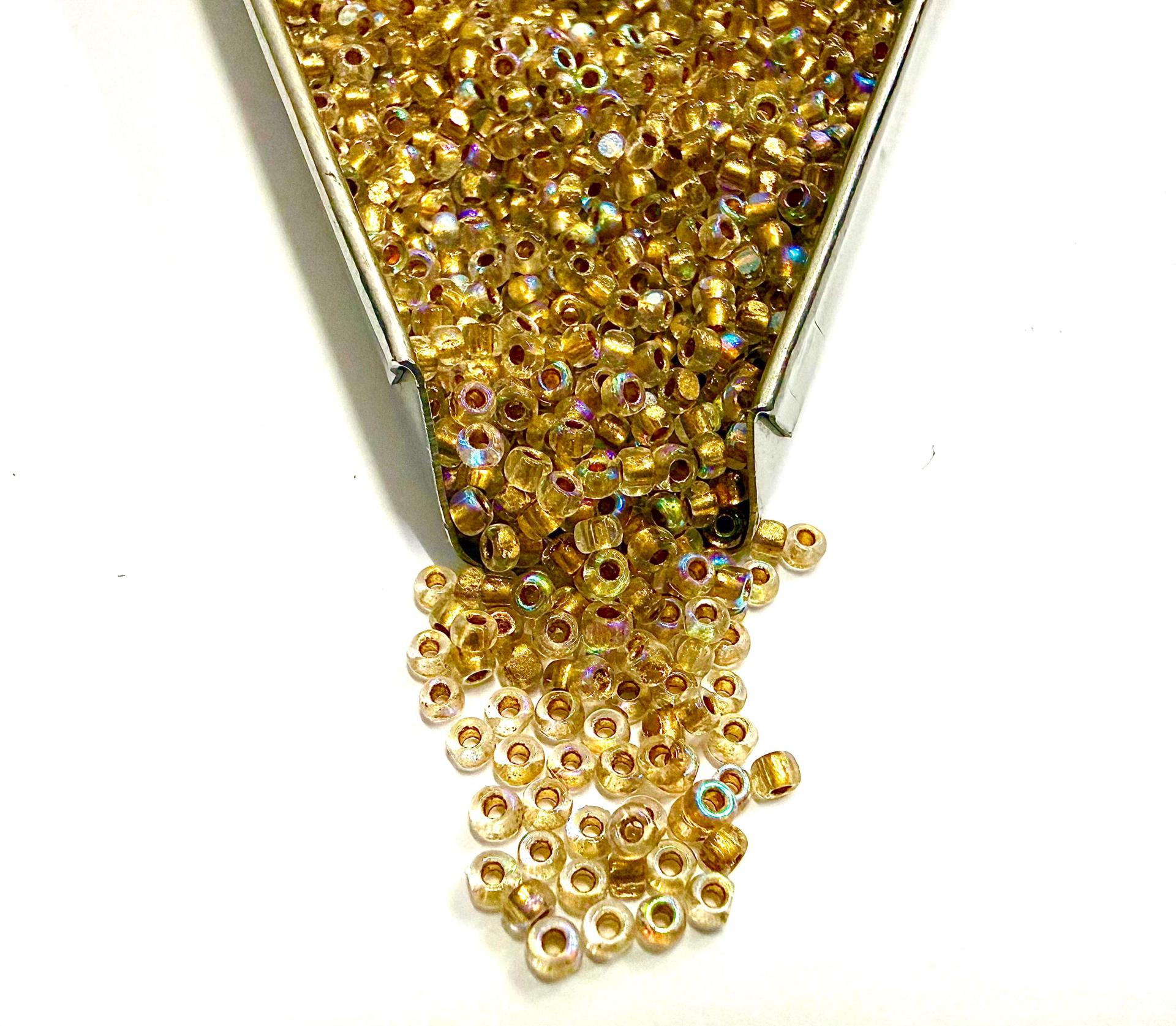 11/0 Charlotte Cut Beads: Patina Dull Gold Lined Aurore Boreale